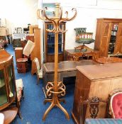 A large bentwood coat & stick stand with rotating