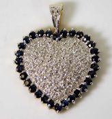 A 9ct gold diamond & sapphire heart shaped pendant