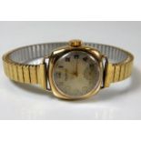 A ladies 9ct gold cased wristwatch with plated str