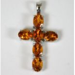 A 9ct cross set with orange citrine stones 4.1g