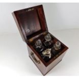 A Georgian mahogany decanter box with four decante