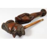 A carved novelty pipe with stand 7.25in long
