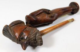 A carved novelty pipe with stand 7.25in long