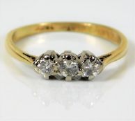 An 18ct c.1940's trilogy ring set with 0.25ct of p