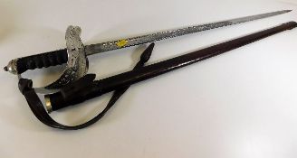 A George V officers sword by R. Groves of 53 Wellington Street Woolwich with leather scabbard 38.5in