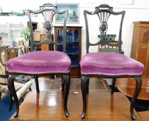 A pair of ebony style dining chairs with cabriole