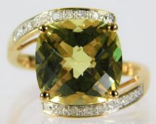 A 9ct gold ring set with lemon citrine & diamonds