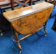 A Victorian burr walnut Sutherland table with cera