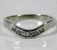 A 9ct white gold wishbone style ring set with diam