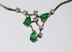 A 14ct gold emerald & diamond necklace 10.8g