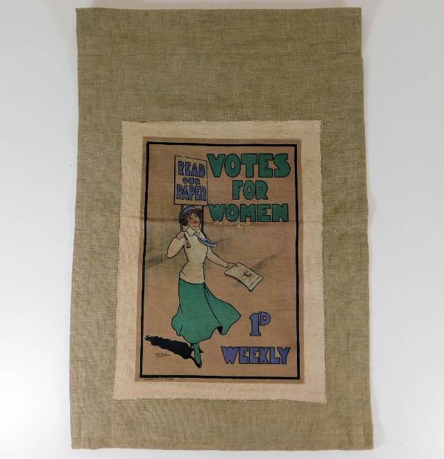 A linen canvas depicting a suffragette banner, min