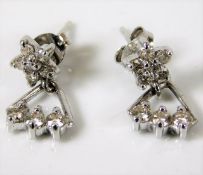 A pair of 18ct white gold earrings set with 0.6ct