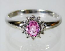 A 9ct gold ring set with diamond & pink sapphire 2