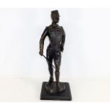 A bronze soldier figure with sword 15in tall