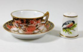 A miniature Royal Crown Derby cup & saucer with im