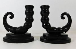 A pair of early 20thC. candle holders, possibly ba