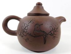 A Chinese porcelain Yixing teapot 5.75in wide