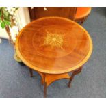 An Edwardian mahogany table with inlaid decor & bo