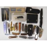 A quantity of various pocket knives, trench art st