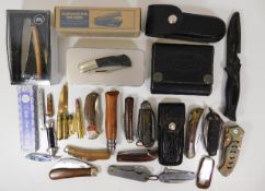 A quantity of various pocket knives, trench art st