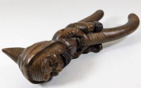 An antique carved nutcracker inscribed "Pilatus" 1