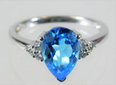 A 9ct white gold ring set with London Blue topaz &