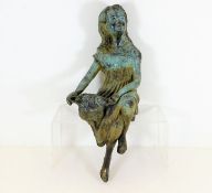 A bronze garden ornament depicting a girl approx 1