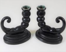 A pair of early 20thC. candle holders, possibly ba