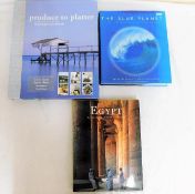 Assortment of coffee table books including The Blu