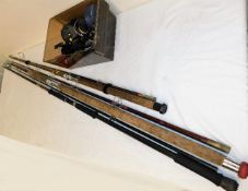 Three sea angling rods and box of reels