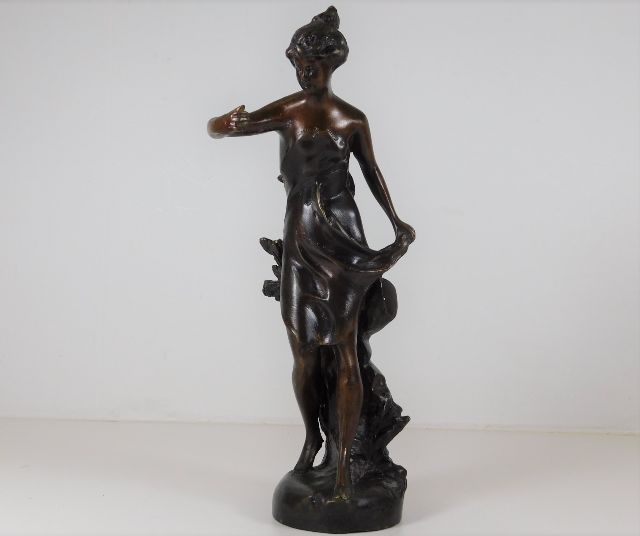 Bronze figurine of a woman approx 10.75" tall