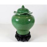 A Chinese porcelain celadon vase & cover decorated