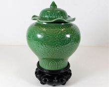 A Chinese porcelain celadon vase & cover decorated