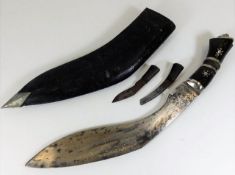 One large Kukri knife and leather sheath