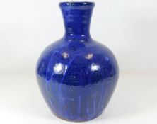 A Trevor Corser studio pottery vase with blue glaze 10.25in tall