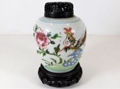 Oriental jar with carved wooden lid approx 6.5" in