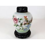Oriental jar with carved wooden lid approx 6.5" in