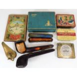 A collection of vintage cigarette tins, an oil lam