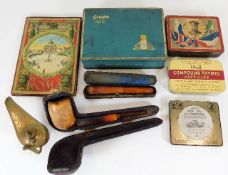 A collection of vintage cigarette tins, an oil lam