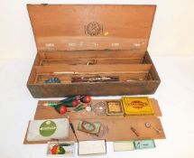 A box of vintage fishing tackle