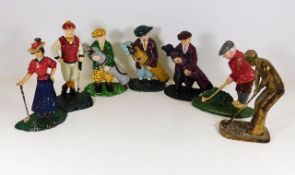 Seven metal doorstops with a golf related theme th