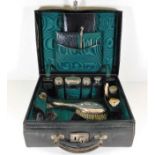 An antique ladies vanity case including some silve