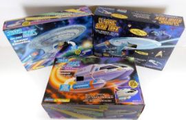 Three boxed Star Trek model vehicles twinned with