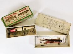 Two boxed fishing lures including a Farlow's tube