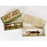 Two boxed fishing lures including a Farlow's tube