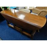 A mahogany drop leaf table in style of wake table