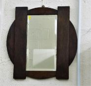 A mid 20thC. oak framed mirror 20.5in H