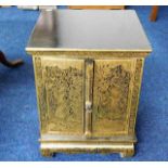 An Oriental lacquerware cabinet with gilded decor