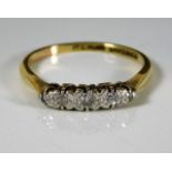 An 18ct gold ring set with platinum mounted diamon