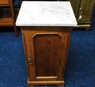 A marble topped pot cupboard